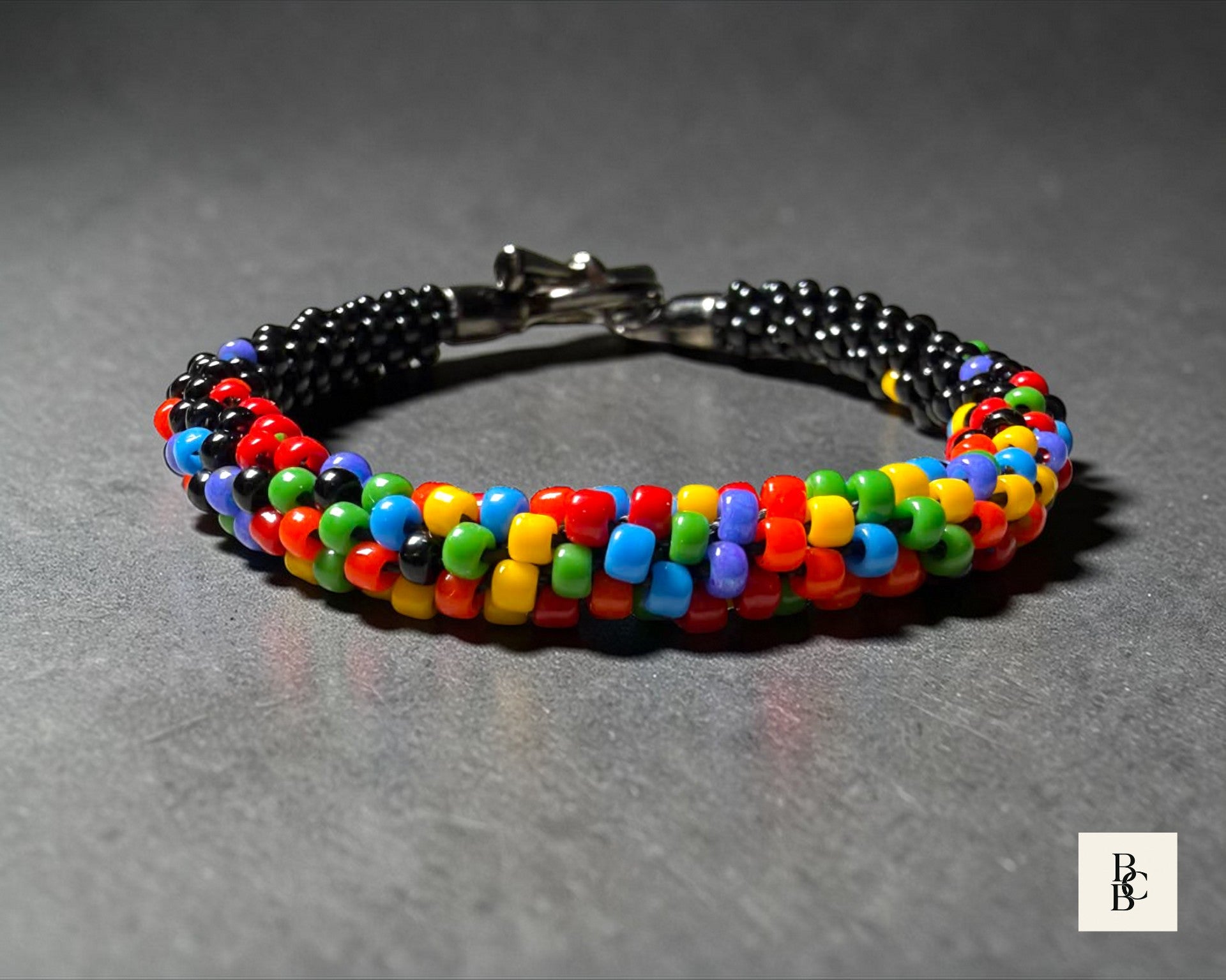 Close-up beadwork detail of Confetti Explosion Pride Kumihimo bracelet with multicolor glass seed beads