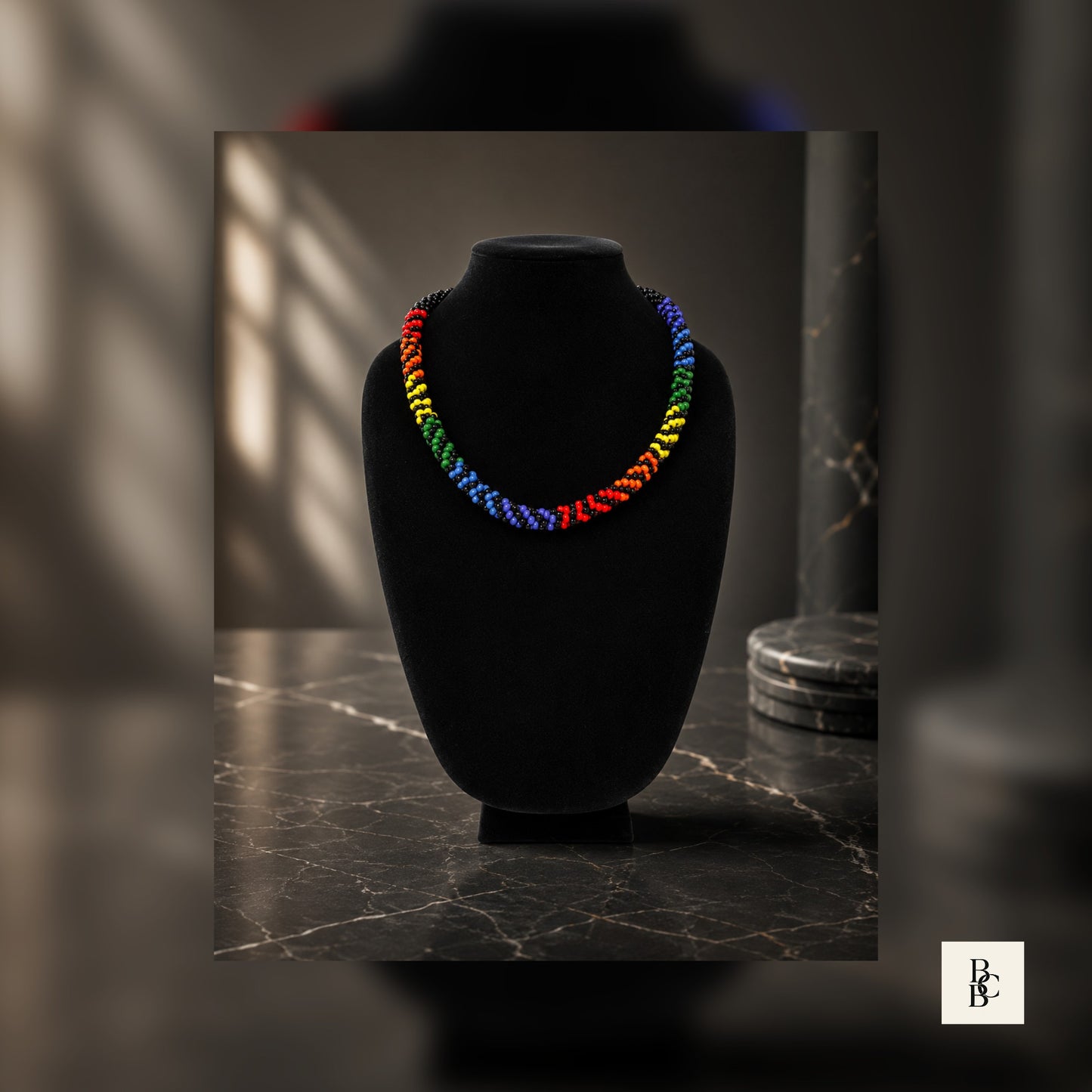 Full display of Rainbow Illusion Pride Kumihimo necklace with black accents on luxury jewelry-style background