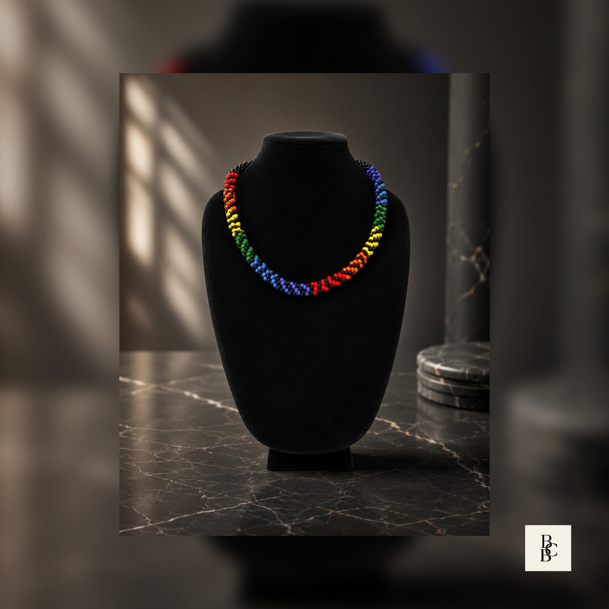 Full display of Rainbow Illusion Pride Kumihimo necklace with black accents on luxury jewelry-style background